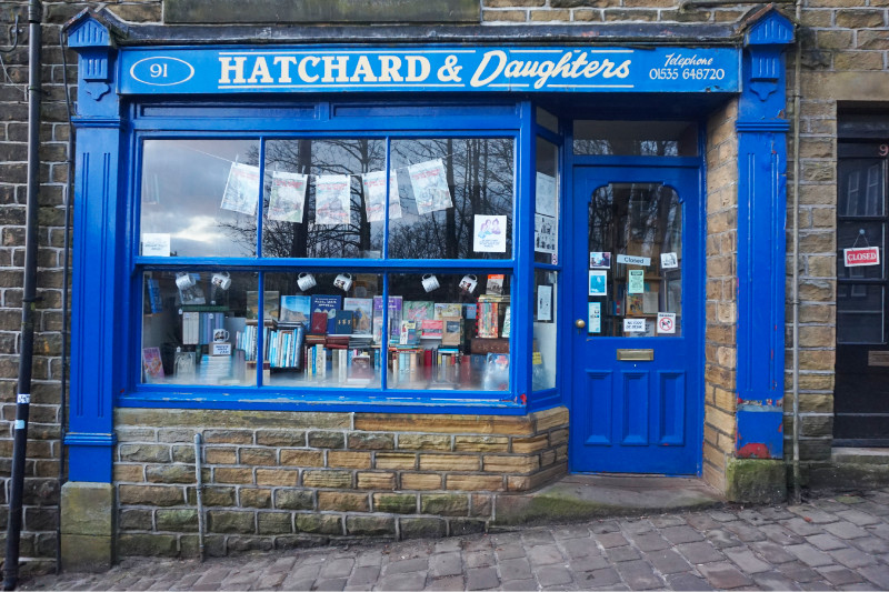 Blue shop front saying Hatchard & Daughters, Haworth, Yorkshire